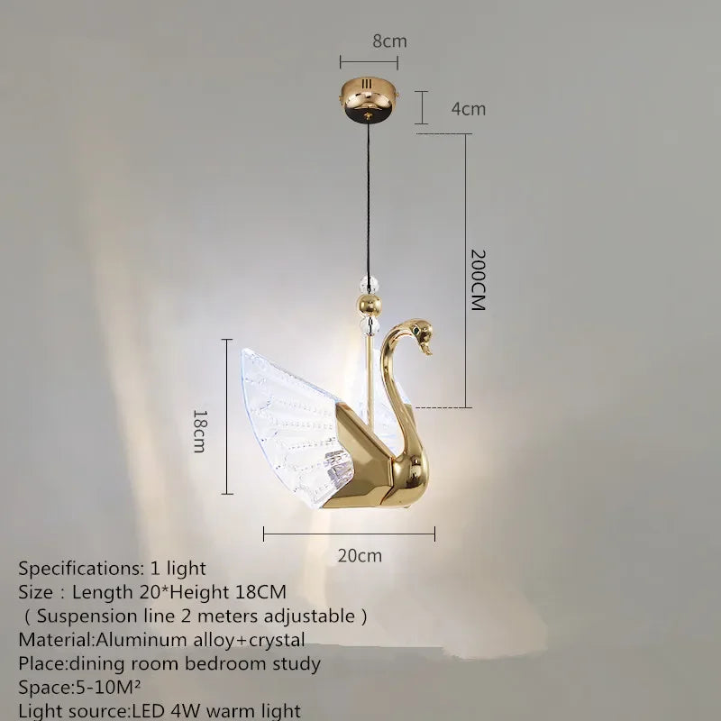 Gold swan-shaped pendant light with dimensions on a gray background