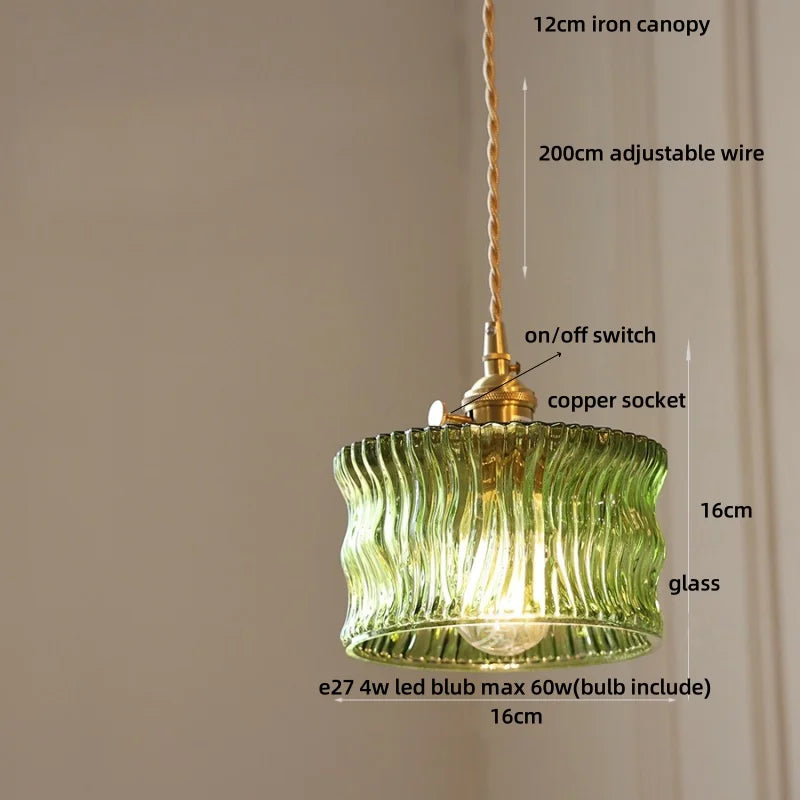 Green pendant light with labeled parts on a beige background