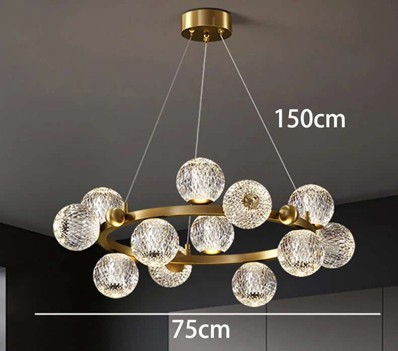 Chandelier with crystal balls and gold frame on a dark background