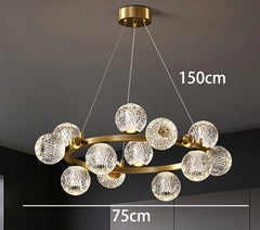 Chandelier with crystal balls and gold frame on a dark background