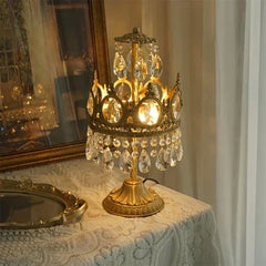 Decorative lamp with crystal accents on a tableclothed table