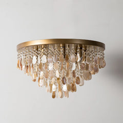 Side view of the gold shell and crystal cascading pendant light fixture.