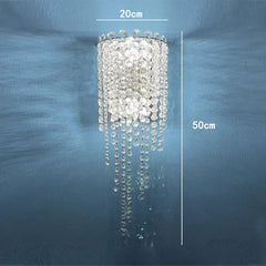 Crystal chandelier with measurements on a blue wall