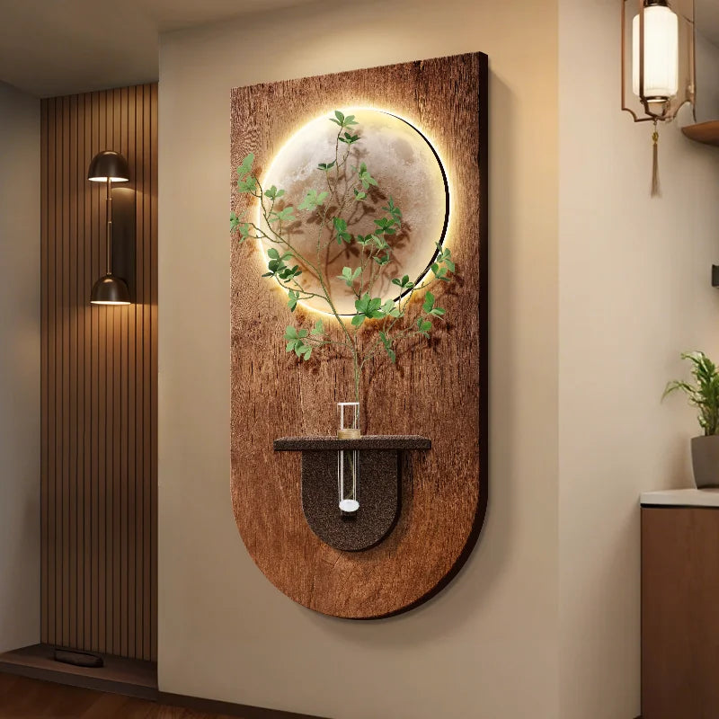 Modern wood grain wall light with a circular illuminated moon motif and a central plant holder, mounted on a wall.