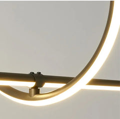 Modern wall light fixture with gold metal frame and white background