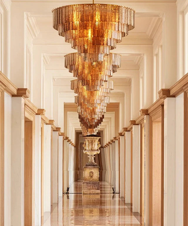 Luxurious chandelier hanging in a hallway with reflective floor
