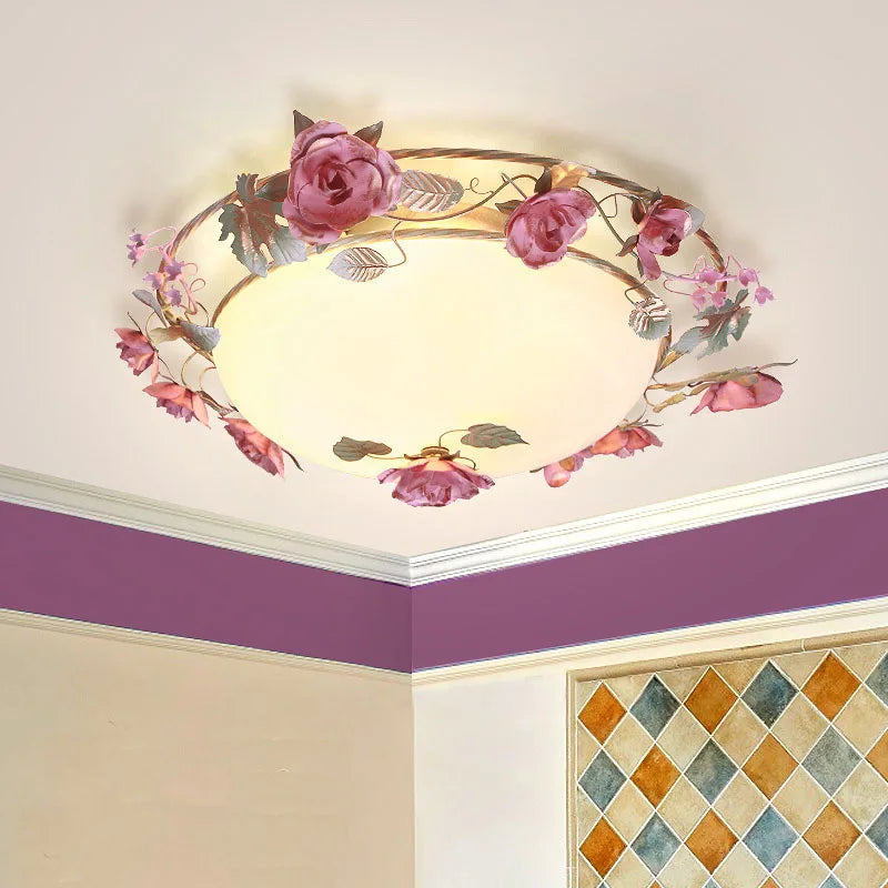Pink rose bud floral design semi-flush ceiling light installed in a room corner with purple accent wall and patterned tiles