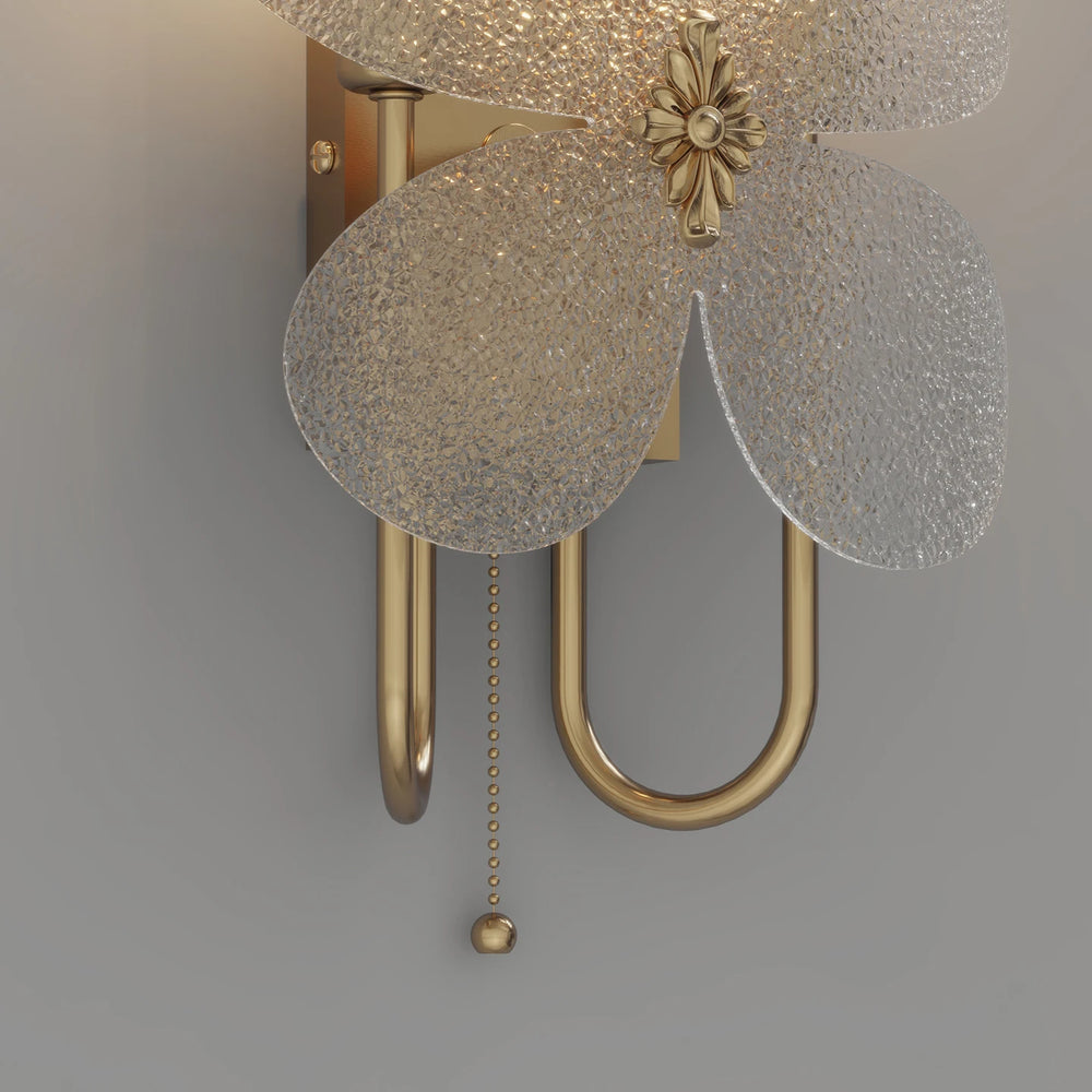 Decorative wall light fixture with floral design on a gray background