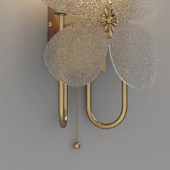 Decorative wall light fixture with floral design on a gray background