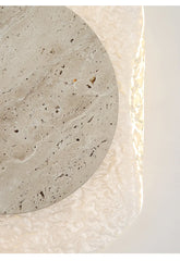 Close-up of a textured stone surface with a circular cutout