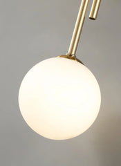 Modern Gold Brass Sconce with Three Frosted Globe Shades