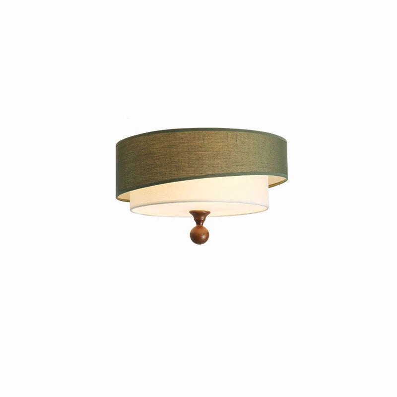 Ceiling light fixture with green shade and wooden finial on a white background