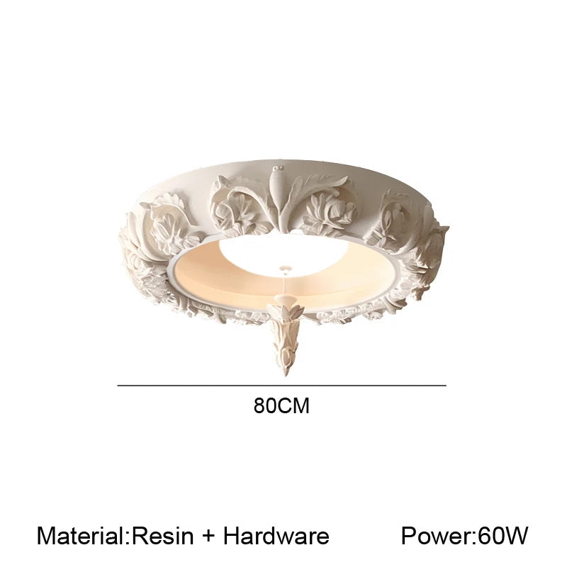 Decorative ceiling light fixture with floral patterns on a white background