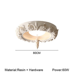 Decorative ceiling light fixture with floral patterns on a white background