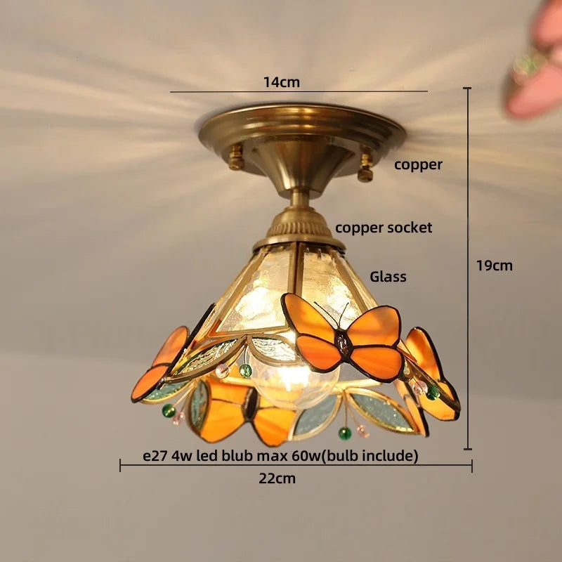 Ceiling light fixture with butterfly design and measurements on a neutral background