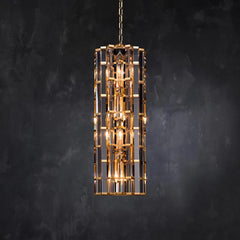 Tall gold framed pendant light with faceted crystal details