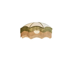 White fabric pendant light with green and peach tassels isolated on a white background