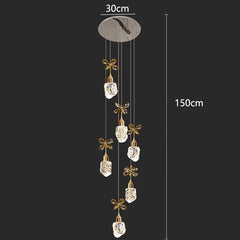 Decorative hanging mobile with crystal-like elements and measurement details on a black background