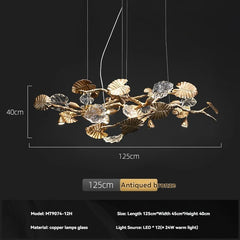 Decorative chandelier with leaf design on a black background