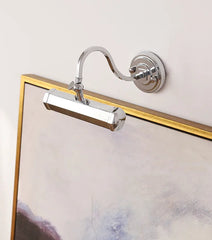 Wall-mounted lamp with flexible arm on a light gray background