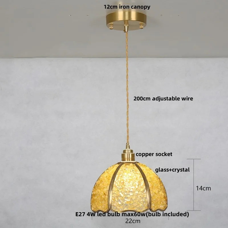 Gold pendant light with labeled features on a gray background