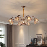 Bronze floral glass shade chandelier hanging from a ceiling.