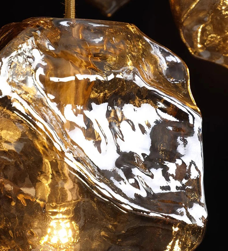 Close-up of a gold pendant with a textured surface