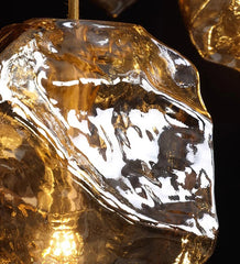 Close-up of a gold pendant with a textured surface