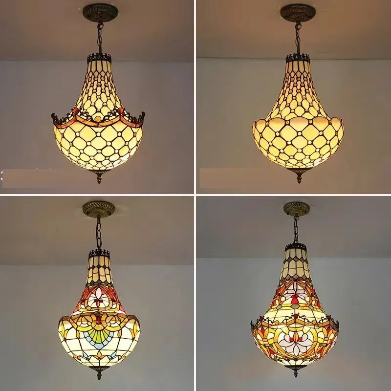 A close-up of the detailed stained glasswork on a pendant light, featuring a polished chrome metal base and hanging hardware.