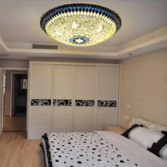 Close-up view of the glass mosaic starburst flush mount ceiling light