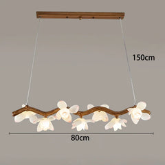 Pendant light fixture with floral design and dimensions on a gray background