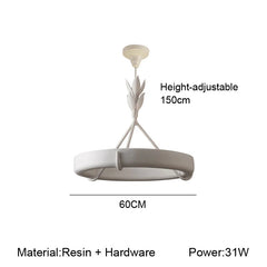 Pendant light with leaf design on a white background, featuring text about height, dimensions, material, and power.