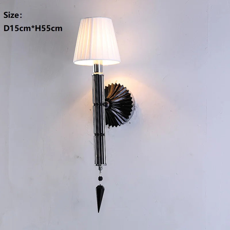 Wall-mounted lamp with decorative design on a white wall