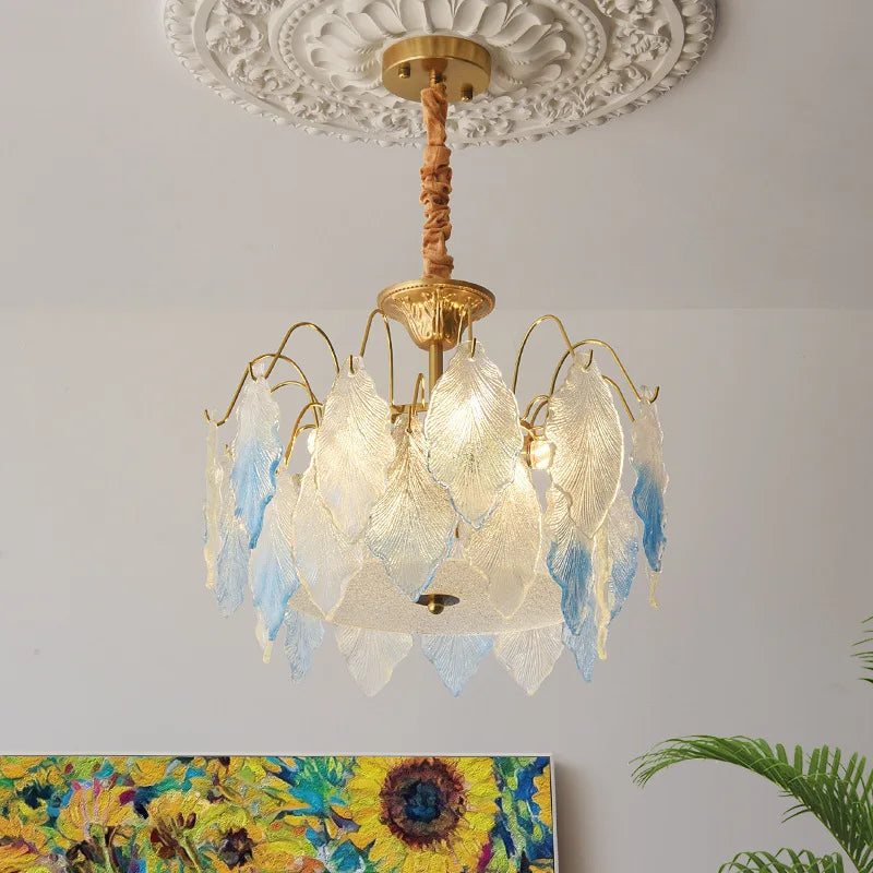 Decorative ceiling light fixture with floral design on a white wall.