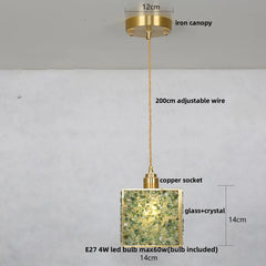 Gold pendant light with labeled parts on a gray background