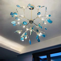 Close-up of a gold finished sputnik chandelier with blue agate slices