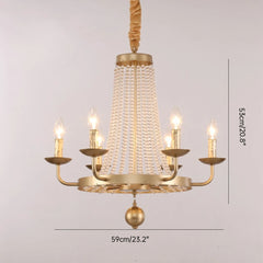 Gold chandelier with crystal accents on a light gray background