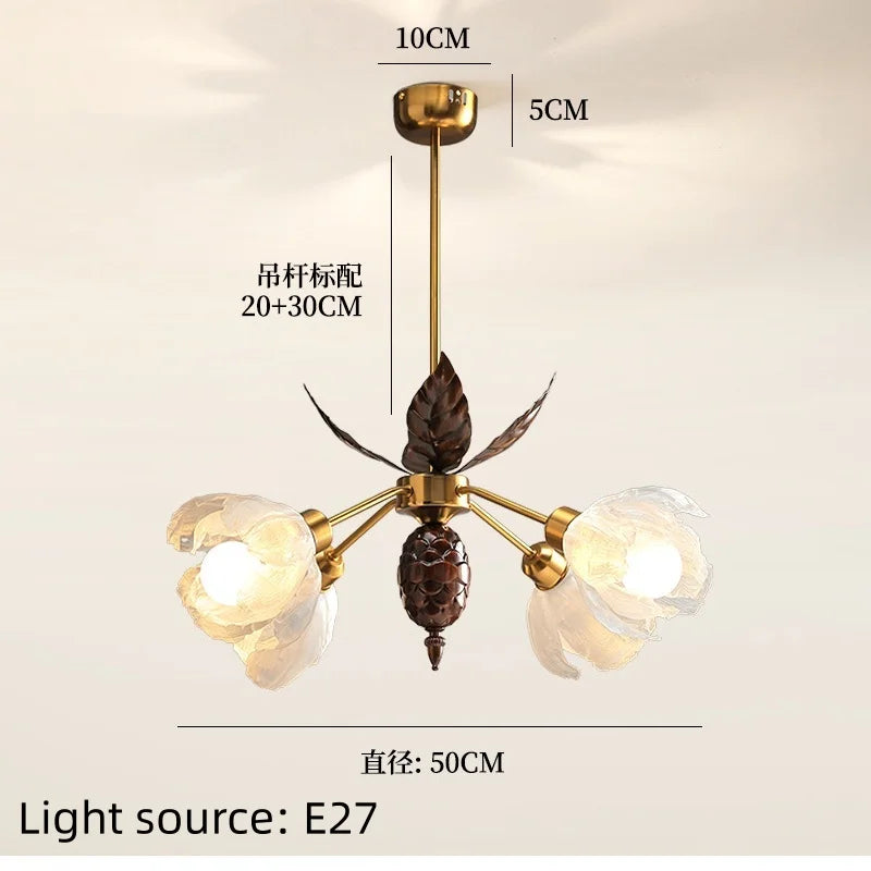 Chandelier with leaf design and measurement details on a beige background