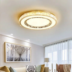 Ceiling light fixture in a living room setting with a couch and framed picture.