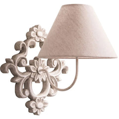 Decorative wall lamp with floral design on a white background.
