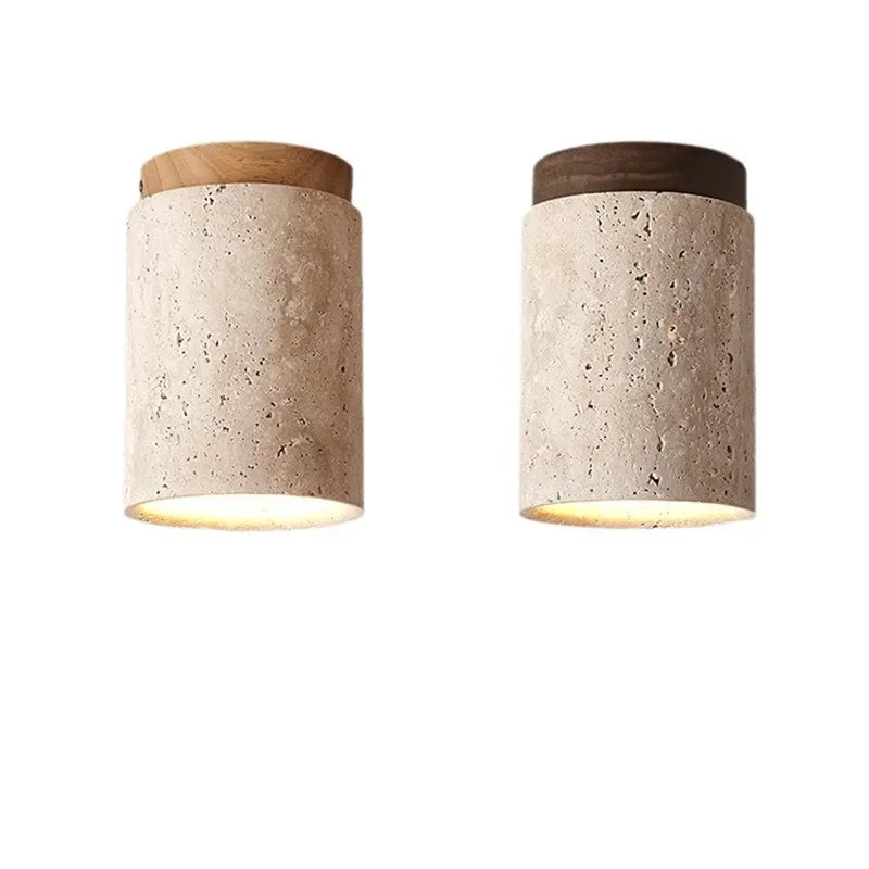 Two cylindrical pendant lights with stone texture and wood tops, one with a light wood top and one with a dark wood top, displayed against a white background.