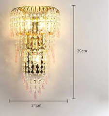 Decorative wall light with crystal details and dimensions on a gray background