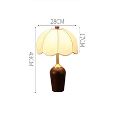 Table lamp with dimensions indicated on a white background