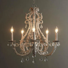 Vintage-style chandelier with five lights on a dark background