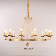 Gold chandelier with multiple candle-style lights on a plain background