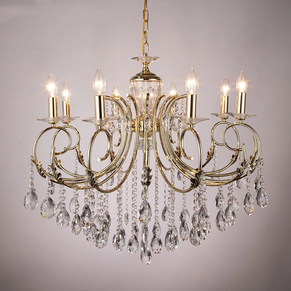 Close-up of a gold candelabra chandelier, highlighting the polished finish and intricate crystal droplets.