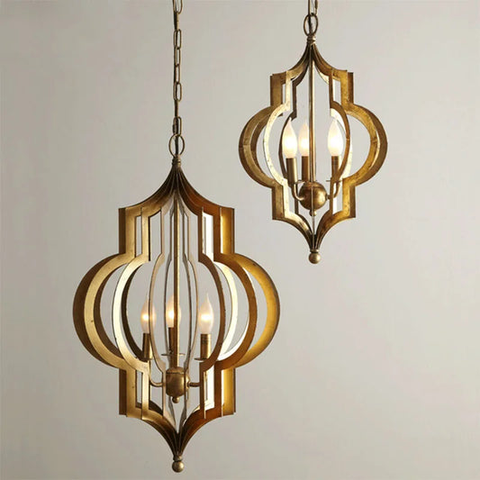 Two gold geometric open frame pendant lights with chain suspension against a white background.