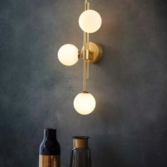 Modern Gold Brass Sconce with Three Frosted Globe Shades