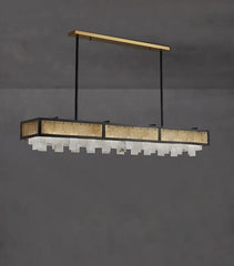 Modern pendant light fixture with gold accents on a gray background