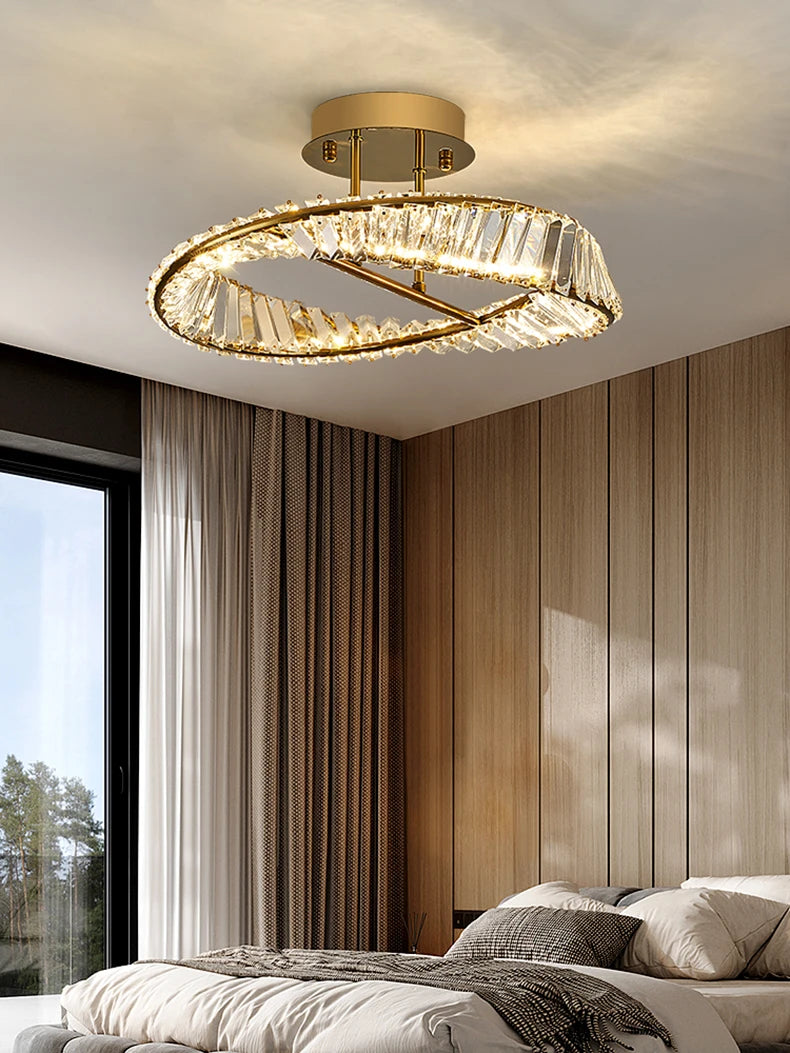 Modern ceiling light fixture in a bedroom with wooden paneling and large window.
